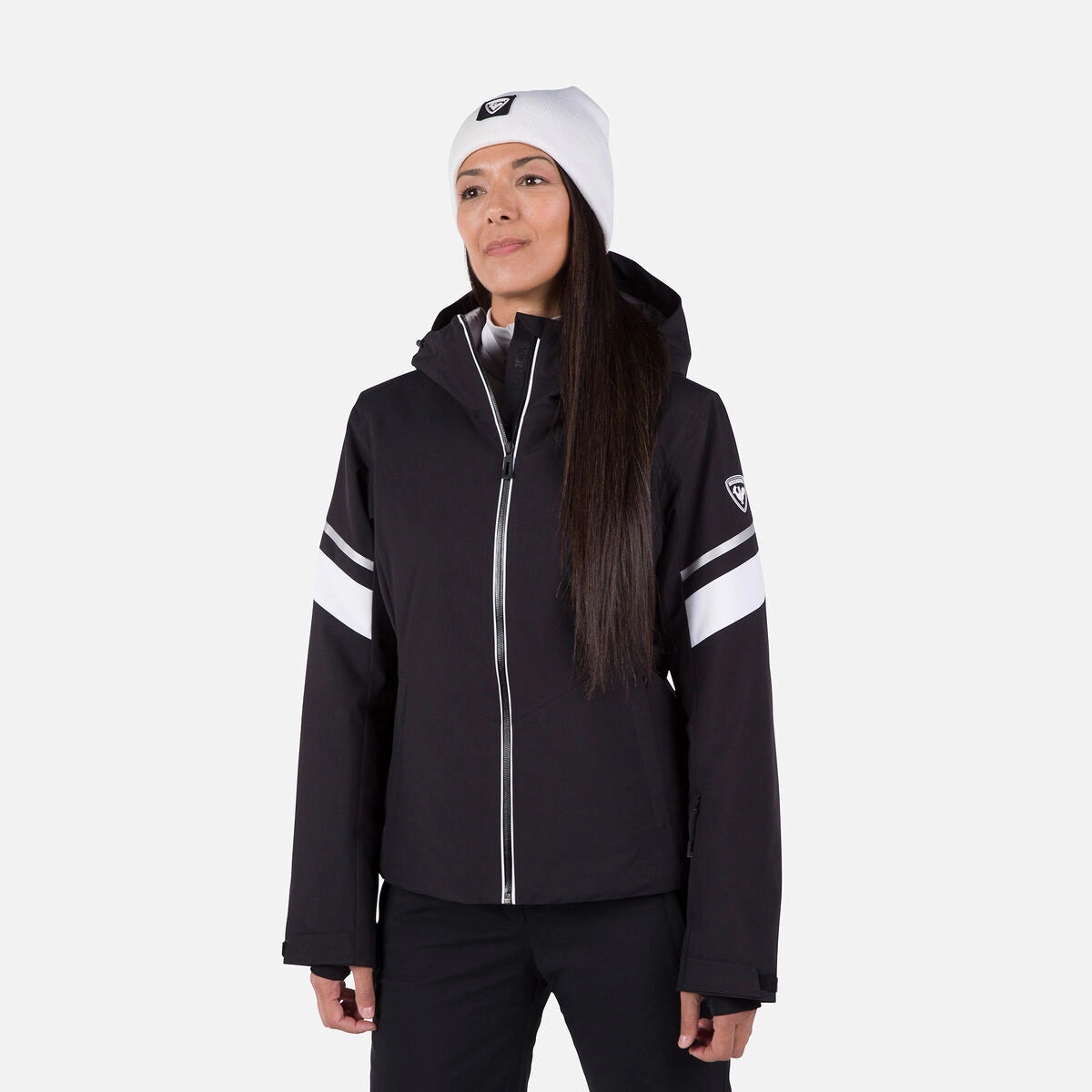 Rossignol Strawpile women's jacket in black with white sleeve stripes, front view on a model wearing a white beanie. Come in to Willi's Ski and Board.