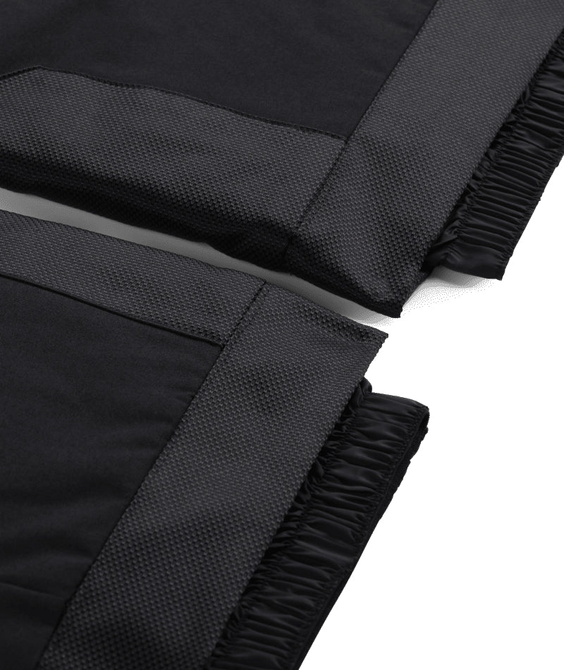 Spyder Propulsion Junior Pant ski pant -- Black colorway side view showing side zip ventilation