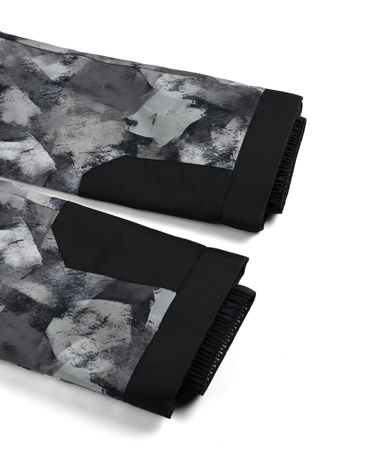 Spyder Propulsion Junior Pant 2026 ski pant -- Black Camo colorway boot gaiter and cuff detail