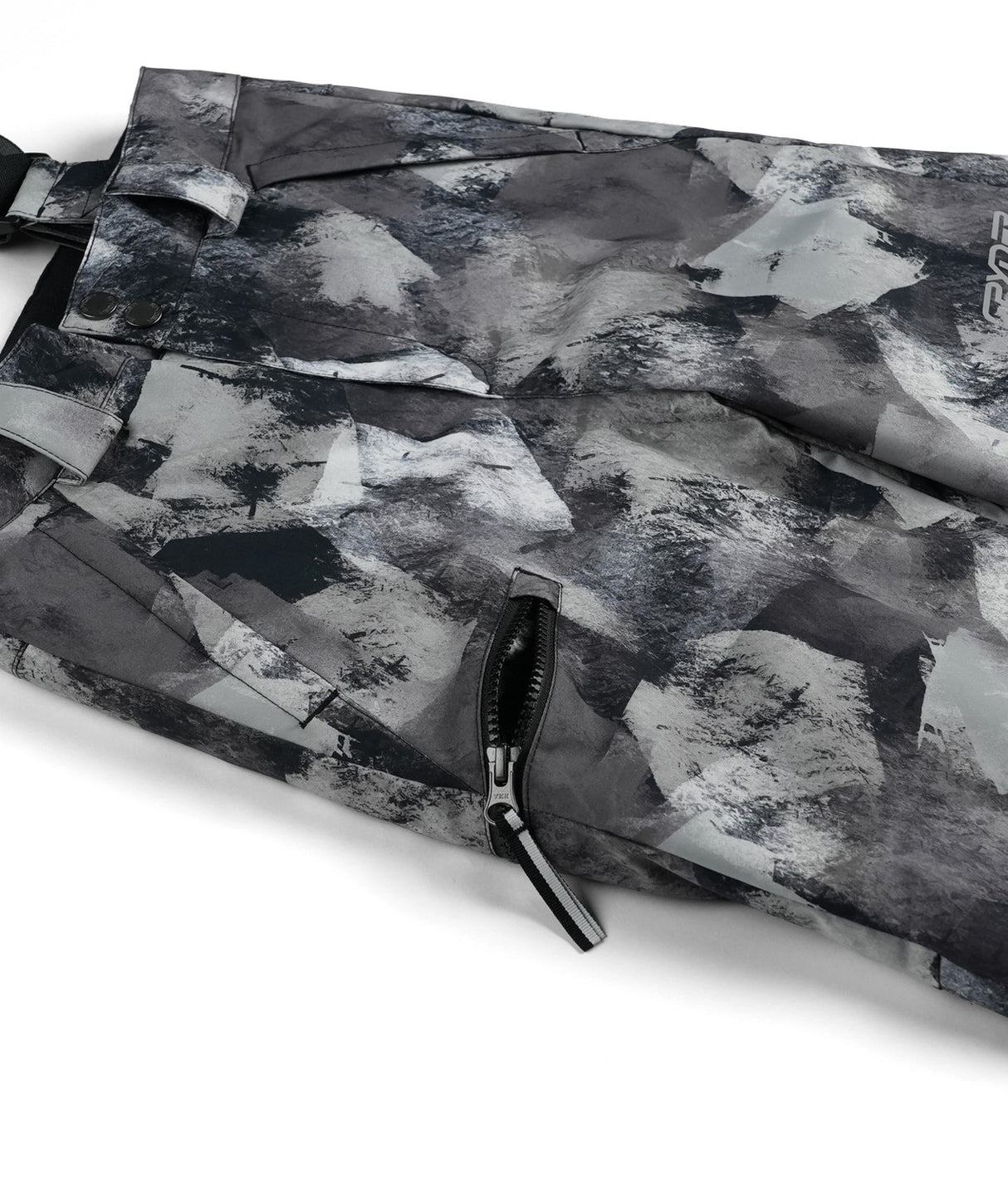 Spyder Propulsion Junior Pant 2026 ski pant -- Black Camo 8 colorway boot gaiter and cuff detail