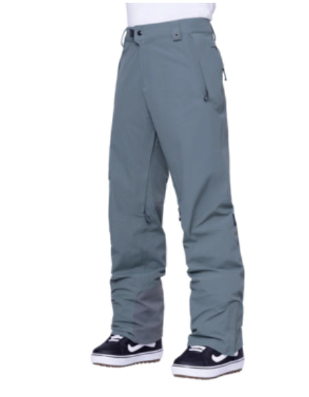 686 Gore-Tex GT men's pant in blue-gray, front view on a model wearing black and white skate shoes. Come in to Willi's Ski and Board.