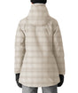 686 Spirit Womens Jacket 2026 ski jacket -- Limestone Plaid colorway front view on model with hood and cuffs