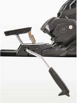 Armada Strive 14 GW ski bindings, side view close-up of the heel lifter and the silver brake arm on the black binding. Available at Willi's Ski Shop.