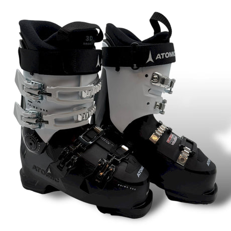 Atomic Hawx Prime 95X W GW women's ski boots in black and white, a pair standing side by side with the buckles and the Atomic name.