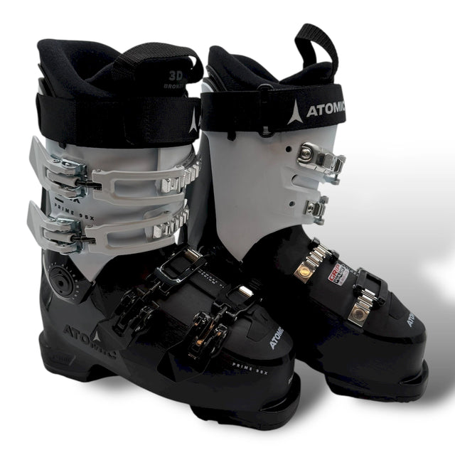 Atomic Hawx Prime 95X W GW women's ski boots in black and white, a pair standing side by side with the buckles and the Atomic name.