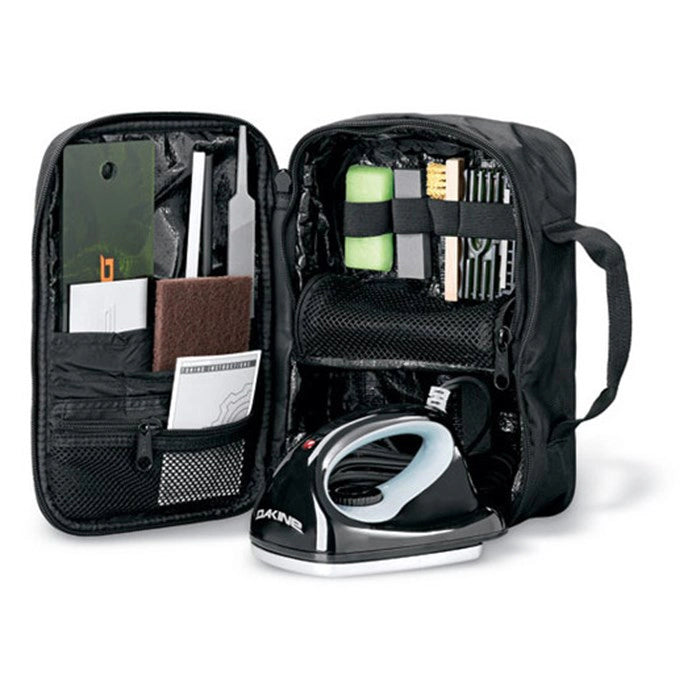 Dakine Super Tuning Kit, open view of the black bag showing the file guides, brushes and wax iron stored inside. Come in to Willi's Ski and Board.