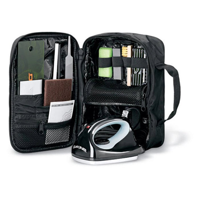 Dakine Super Tuning Kit, open view of the black bag showing the file guides, brushes and wax iron stored inside. Come in to Willi's Ski and Board.