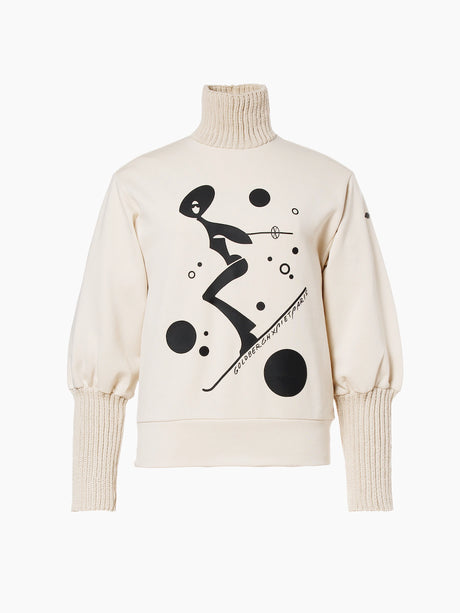 Goldbergh Voyage women's sweater in cream with a black skier and bubbles graphic and ribbed puffed sleeves, front view.