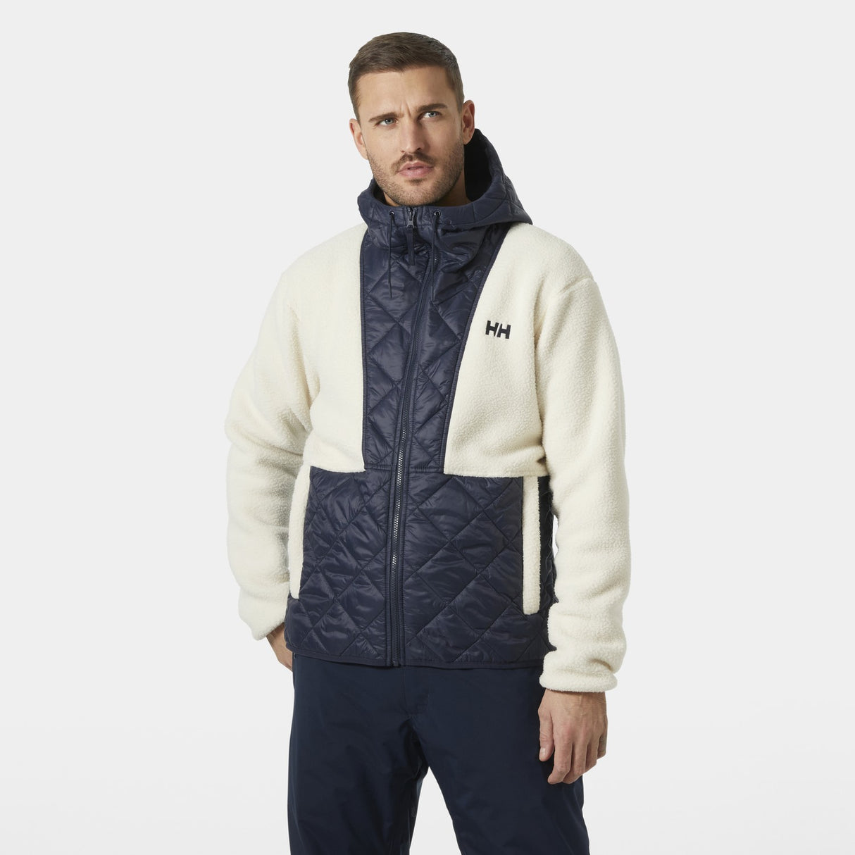 Helly Hansen Stowe Hooded Hybrid Mens Jacket 2026 ski jacket -- Navy colorway front view on model with hood and cuffs