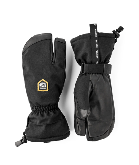 Hestra C-Zone Mountain 3-finger gloves in black with a gold Hestra label, a pair of long cuff gloves with a wrist strap.