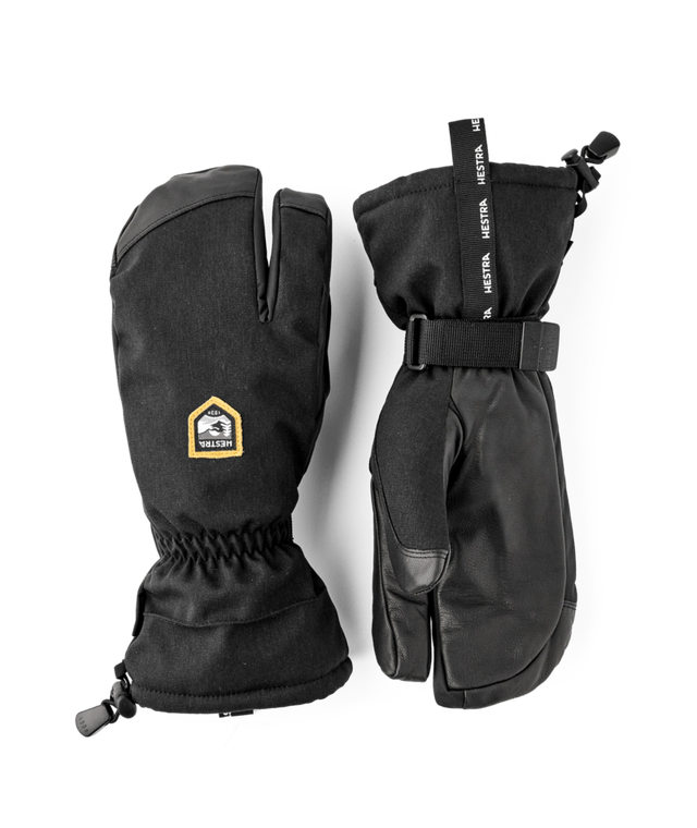 Hestra C-Zone Mountain 3-finger gloves in black with a gold Hestra label, a pair of long cuff gloves with a wrist strap.