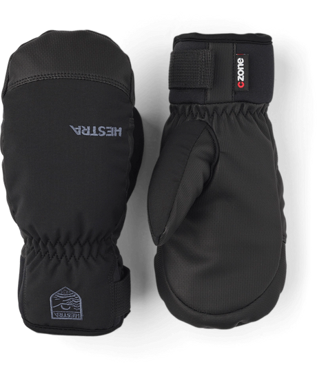 Hestra Ferox junior mittens in black with a C-Zone label and a wrist strap, a pair showing the back and the palm. Come in to Willi's Ski and Board.
