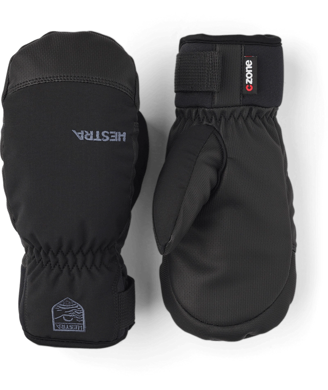 Hestra Ferox junior mittens in black with a C-Zone label and a wrist strap, a pair showing the back and the palm. Come in to Willi's Ski and Board.