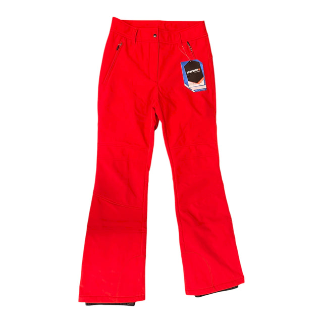 Icepeak Entiat women's pant in bright red, front view of the stretch ski pants with a boot cut hem and a small tag on the pocket.