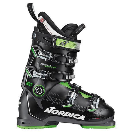Nordica Speedmachine 90 ski boot in black and gray with green accents, side view showing the buckles and the Nordica name.