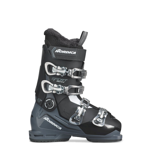 Nordica Sportmachine 3 65 W ski boot in black and gray, side view showing the three silver buckles and the Nordica name on the cuff.