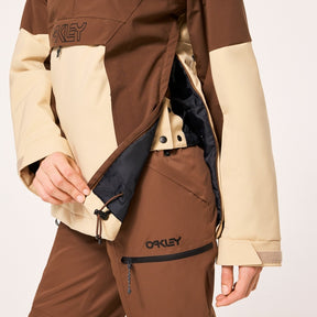 Oakley Tnp Tbt Womens Anorak Jacket ski jacket -- Hummus colorway back view showing articulated powder skirt and fit