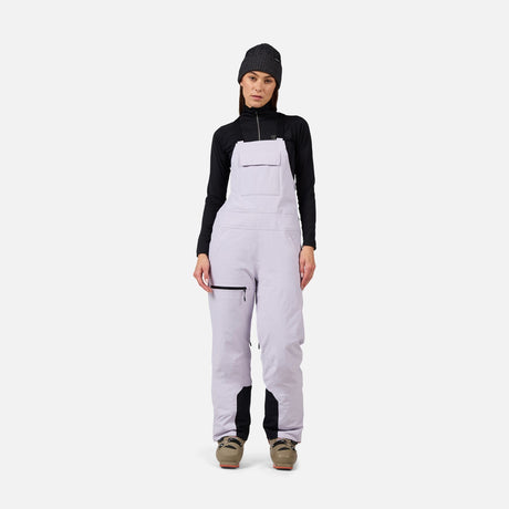 Rossignol Outerlimits Womens Bib 2026 ski pant -- front view on model showing insulated ski pant at Willis Ski and Board