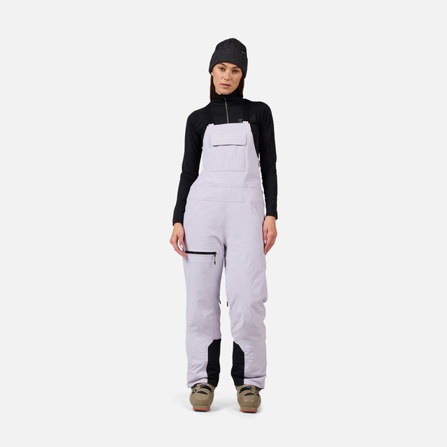 Rossignol Outerlimits Womens Bib 2026 ski pant -- front view on model showing insulated ski pant at Willis Ski and Board