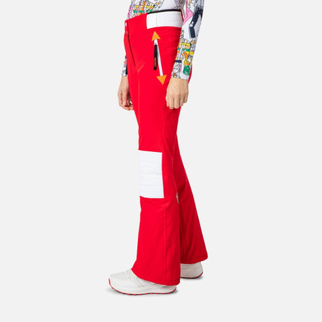 Rossignol Pilot Womens Stretch Pant ski pant -- Red colorway side view showing side zip ventilation