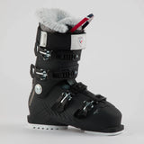 Rossignol Pure 70 women's ski boot in black with a white cuff strap and a fur-lined top, side view showing the buckles. Available at Willi's Ski Shop.