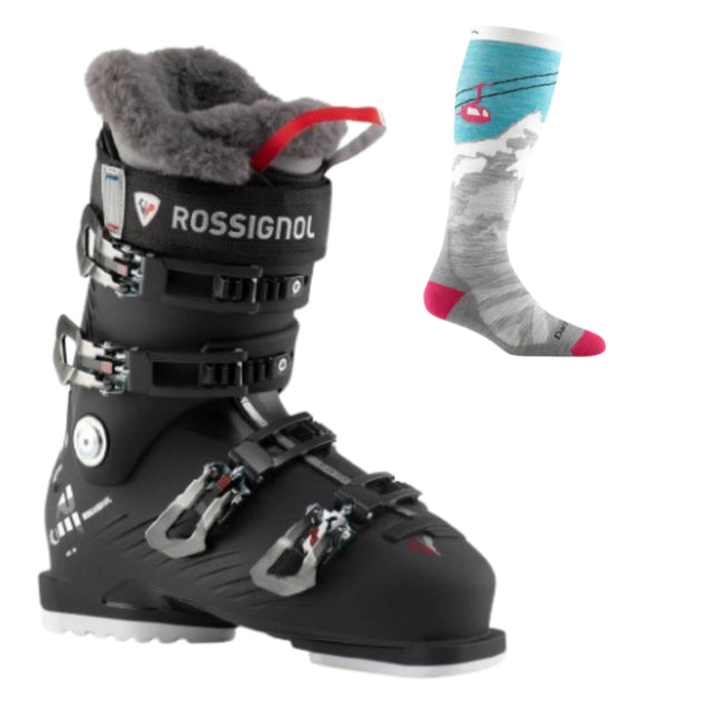 Rossignol Pure Pro 80 women's ski boot in black with a fur-lined cuff and a red pull tab, shown next to a gray ski sock with a gondola print.