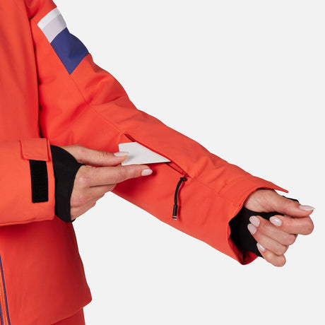 Rossignol Strawpile Womens Jacket 2026 ski jacket -- Orange Flame colorway lifestyle view showing full jacket silhouette