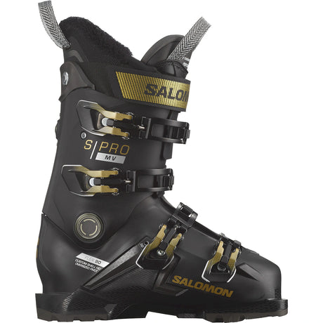 Salomon S Pro MV 90 W GW women's ski boot in black with gold buckles, side view showing the fur-trimmed cuff and the Salomon name.