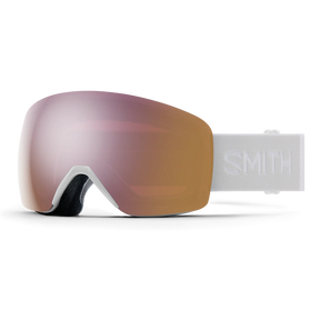 Smith Skyline goggles with a rose gold Chromapop lens, front view of the frameless lens and the white strap with the Smith name.