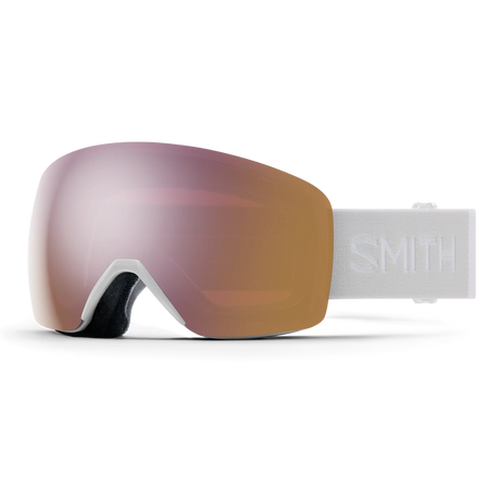 Smith Skyline goggles with a rose gold Chromapop lens, front view of the frameless lens and the white strap with the Smith name.