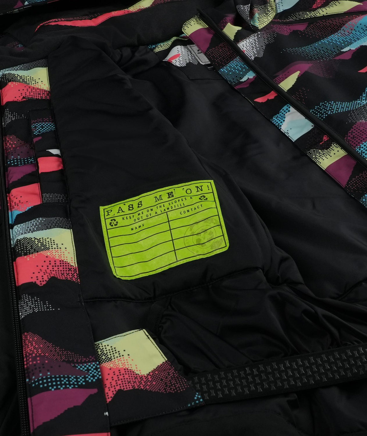Spyder Conquer Junior Jacket 2026 ski jacket -- Mountain Print colorway back view showing articulated powder skirt and fit