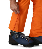 Spyder Dare Mens Pant 2026 ski pant -- Flash Orange colorway side view showing side zip ventilation
