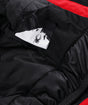 Spyder Leader Junior Jacket ski jacket -- Spyder Red colorway back view showing articulated powder skirt and fit
