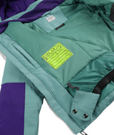 Spyder Mila Junior Jacket ski jacket -- Sea Glass colorway front view on model with hood and cuffs