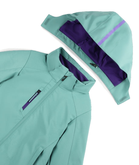 Spyder Mila Junior Jacket ski jacket -- Sea Glass colorway back view showing articulated powder skirt and fit