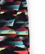 Spyder Olympia Junior Pant 2026 ski pant -- Mountain Print colorway side view showing side zip ventilation