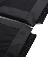 Spyder Propulsion Junior Pant ski pant -- Black colorway side view showing side zip ventilation