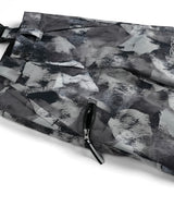 Spyder Propulsion Junior Pant 2026 ski pant -- Black Camo 8 colorway boot gaiter and cuff detail