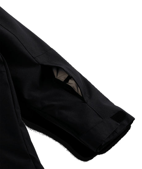 Spyder Slash Junior Jacket ski jacket -- Black colorway back view showing articulated powder skirt and fit
