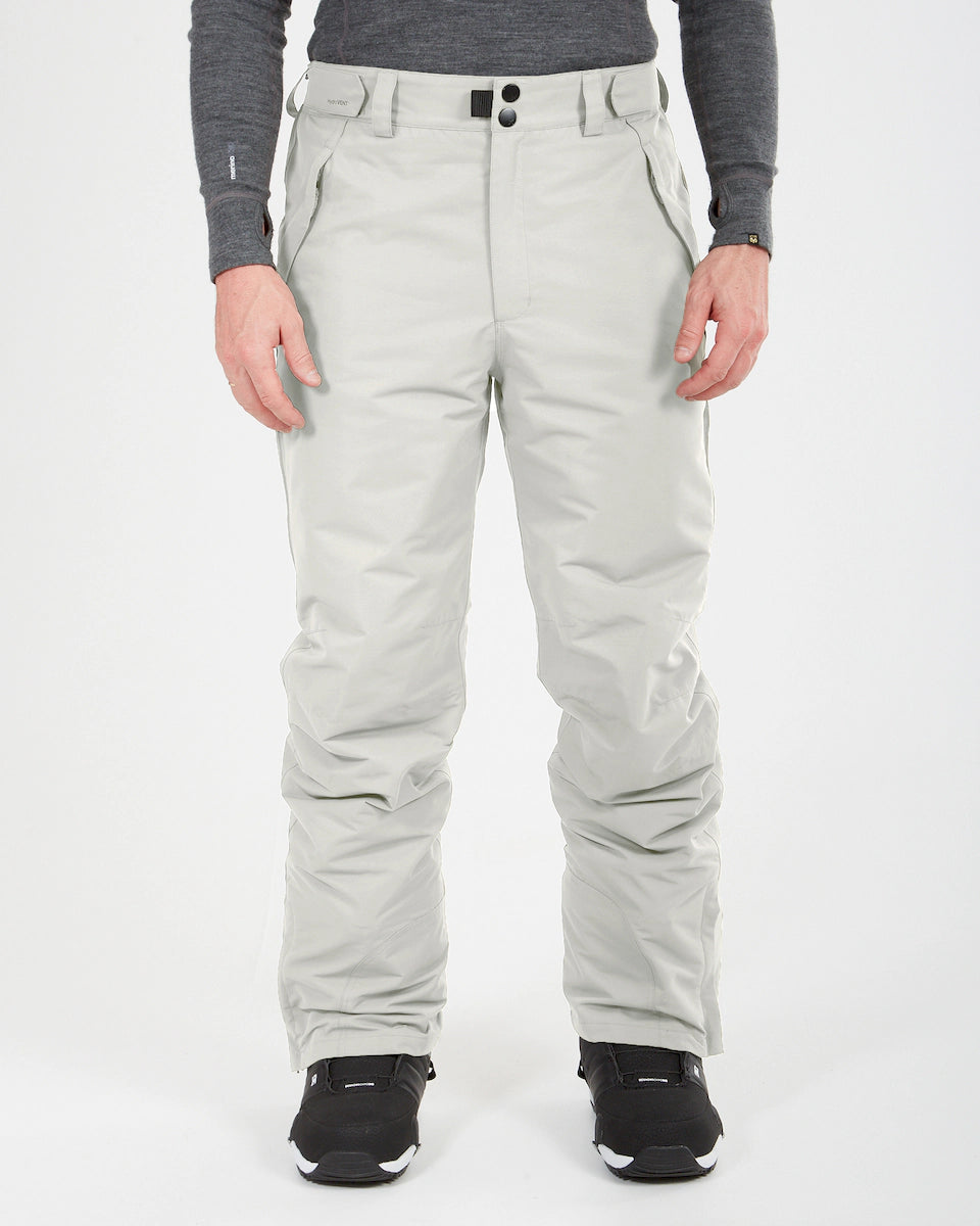 XTM Glide men's pant in light gray with cargo-style pockets and a button waist, front view on a model wearing black shoes.